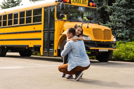 Happy day of back to school. Smiling father taking child to primary school.