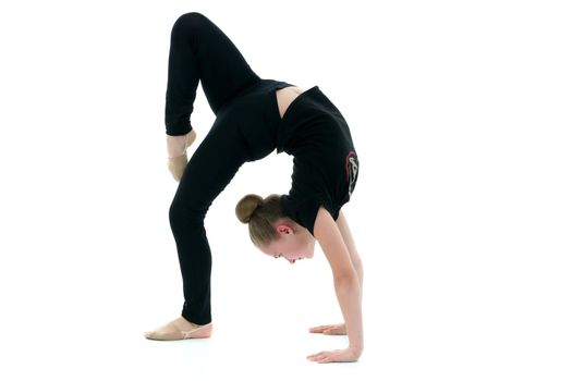 Girl gymnast performs a bridge with a raised leg. The concept of a healthy lifestyle, sport. Isolated on white background.