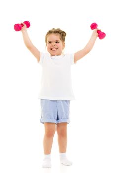 A cute little girl doing exercises with dumbbells. The concept of strength, health and sport. Isolated on white background.