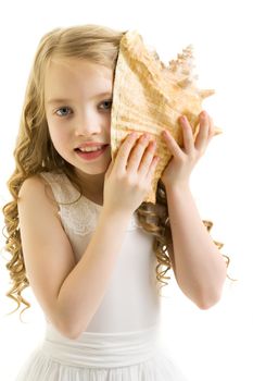 A little girl with a sea shell. The concept of a family vacation at sea, ecology. Isolated on white background.