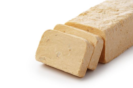 Turkish dessert halva slices isolated on white background