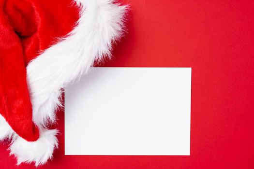 Christmas template for greeting card on red background, top view