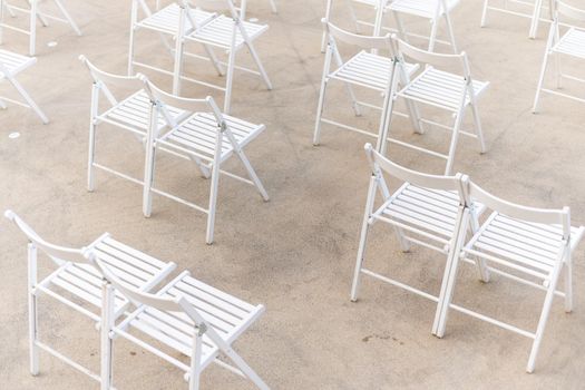 rows of folding chairs, empty seats on event - chair row
