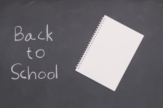 Back to school and education concept  book on blackboard