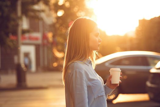 Business woman in a cafe in the summer outdoors on vacation. High quality photo