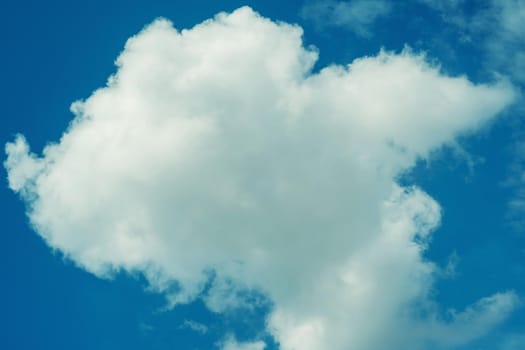 Blue sky background with clouds - image toned