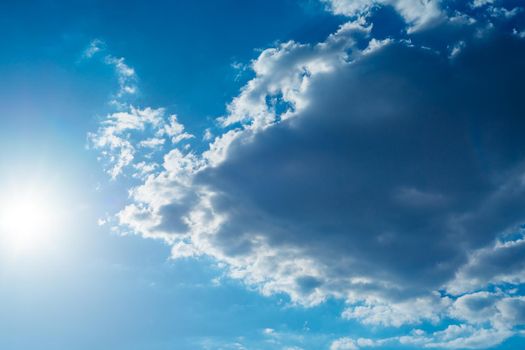 The sun shines bright in summer. Blue sky and clouds.- image