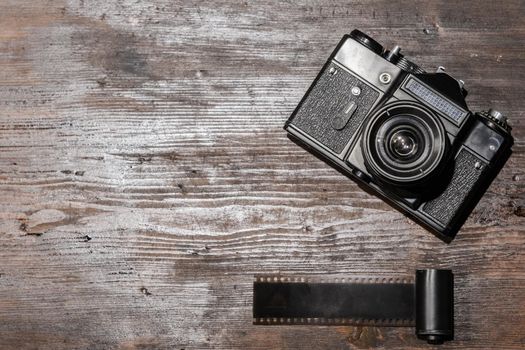 Vintage camera on wooden background