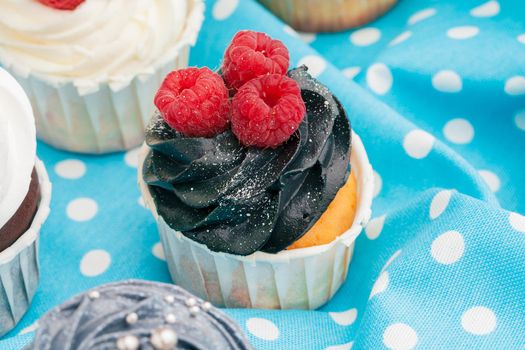Cupcakes decorated with sprinkles and frosting - close up