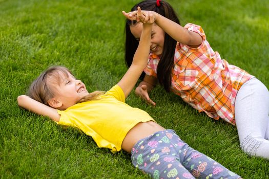 happy excited kids having fun together on playground