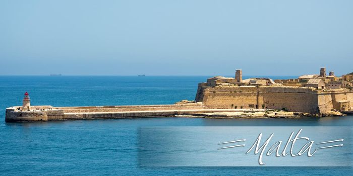 postcard with lighthouse in Valletta port of Malta on misty sea background with a ship