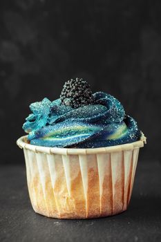 Group of cupcakes on dark background selective focus