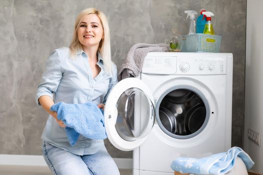 pretty smiling girl in the laundry room