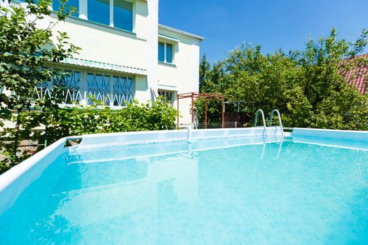 swimming pool in front of the house
