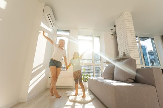 Happy loving family. Mother and her daughter child girl playing and dancing together