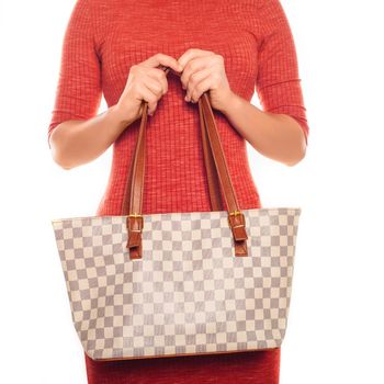 picture of lovely woman in red dress with fashionable checkered bag
