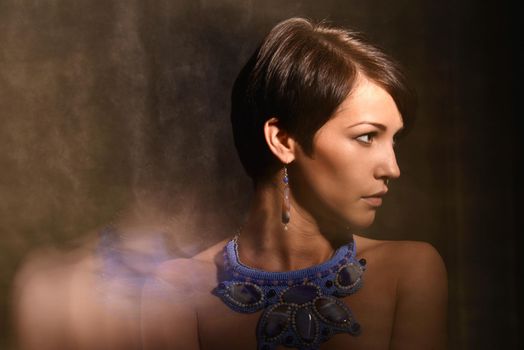 Nice Woman with Jewelry . Necklace and Earrings. mixed light