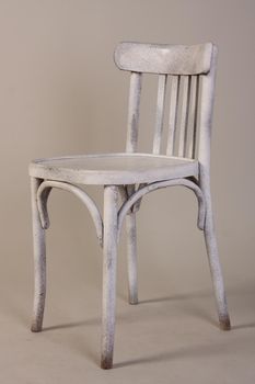 Old vintage white wooden chair isolated on white background.