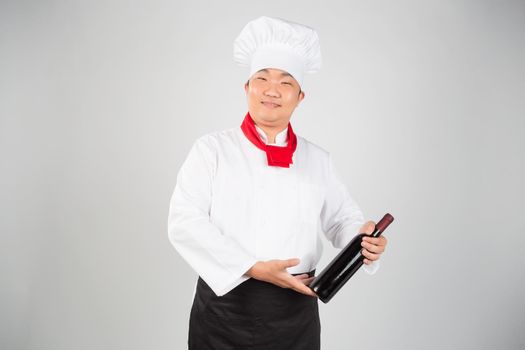 portrait of chef with wine isolated on white