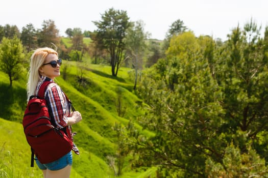 Attractive young woman enjoying her time outside in park, summer