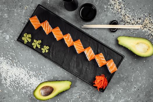 Sushi Philadelphia on a stone decorative plate.