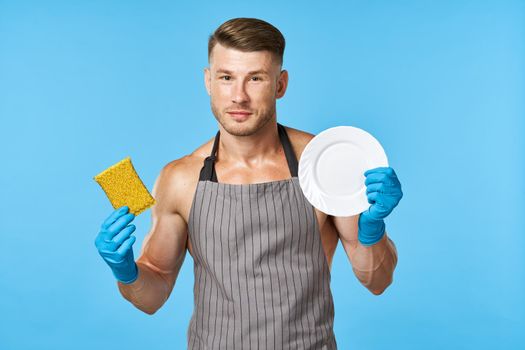 janitor in apron with pumped up body posing service delivery. High quality photo