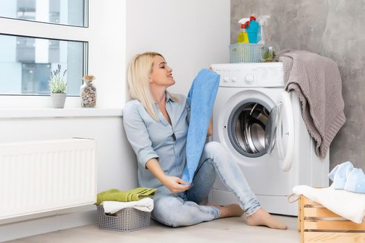 pretty smiling girl in the laundry room