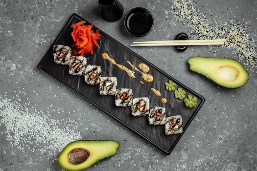 California Roll sushi with smoked eel, cucumber, avocado. Sushi menu. Japanese food.