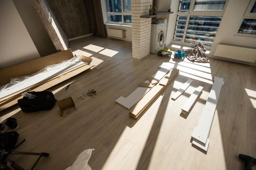 assembly of a double bed made of wood and lamella