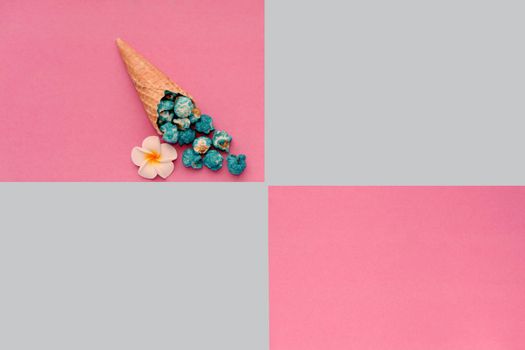 Popcorn spill out from waffle ice cream cone on pastel colorful background. Blue Popcorn on a cone cornucopia. Top view bright hipster background.