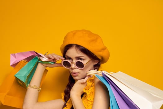 cheerful woman wearing sunglasses posing shopping fashion isolated background. High quality photo