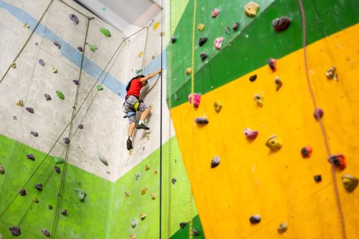 Little Girl Climbing Rock Wall