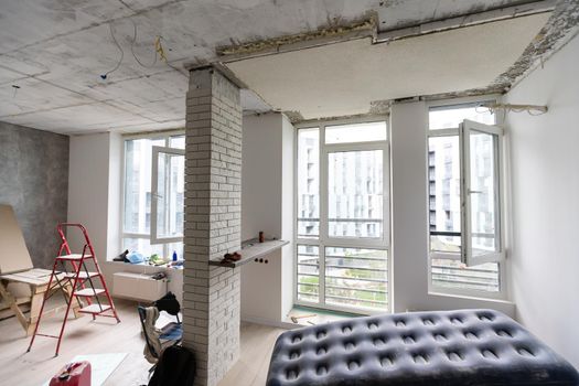 Home renovation in room full of painting tools