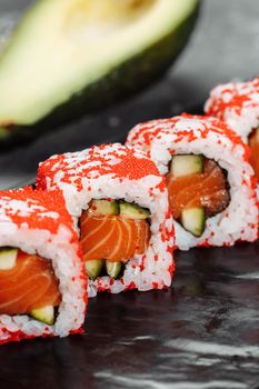 California sushi style rolls, with raw vegetables, food border background.