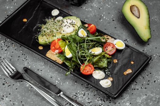 Avocado and cherry tomato salad. Diet breakfast. Healthy food.