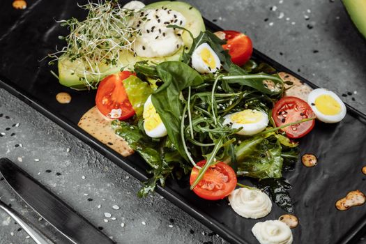 Avocado and cherry tomato salad. Diet breakfast. Healthy food.