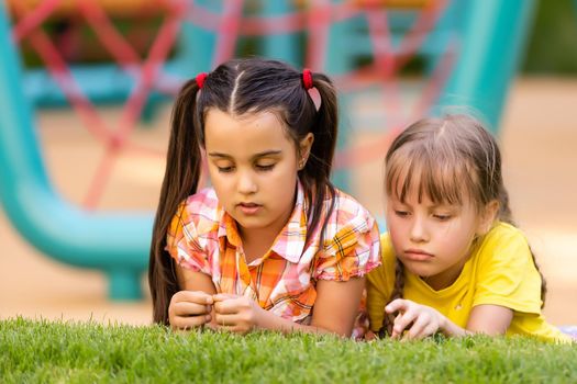 Happy children playing outdoors, children on the playground