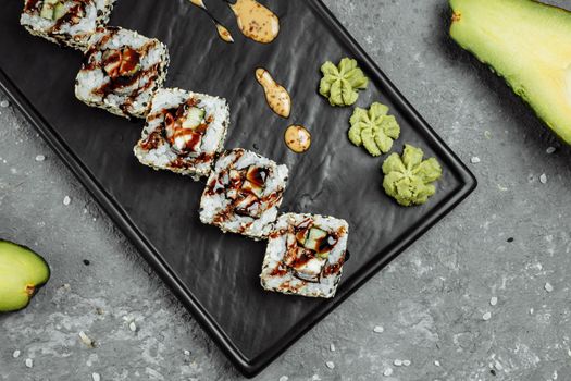 California Roll sushi with smoked eel, cucumber, avocado. Sushi menu. Japanese food.