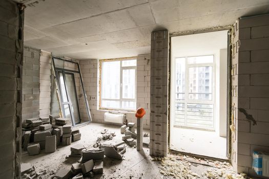 Abandoned house interior, dirty room, rotten peeled walls.