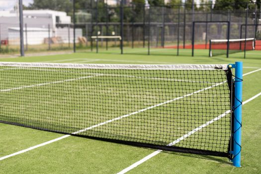 Tennis net and court. Playing Tennis. Healthy lifestyle