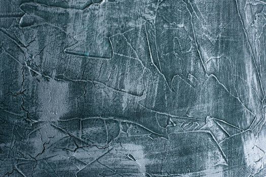 Dramatic blue grunge seamless stone texture venetian plaster background decor. Cracked grungy concrete cement decoration.