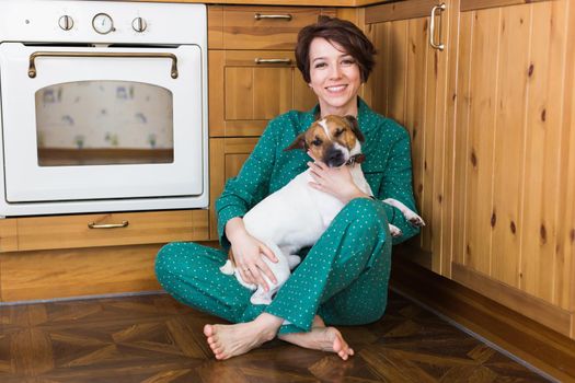Young beautiful woman at home with her cute dog