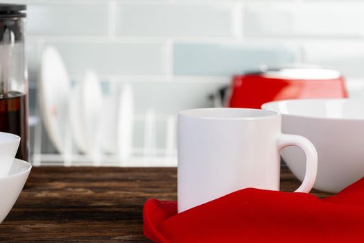 Tea served on a wooden kitchen table. Close up.