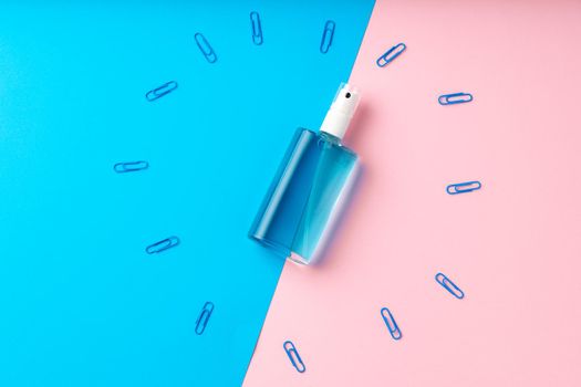 Hand sanitizer gel and school supplies top view, copy space