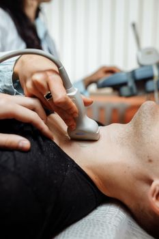 the nurse will perform an ultrasound scan on the patient neck in the office.