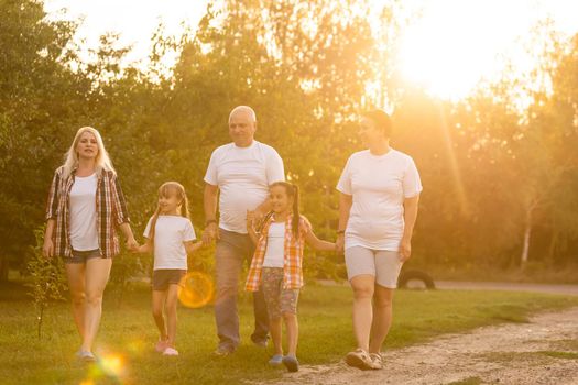 Multi Generation Family On Countryside Walk