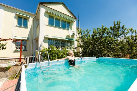 swimming pool in front of the house