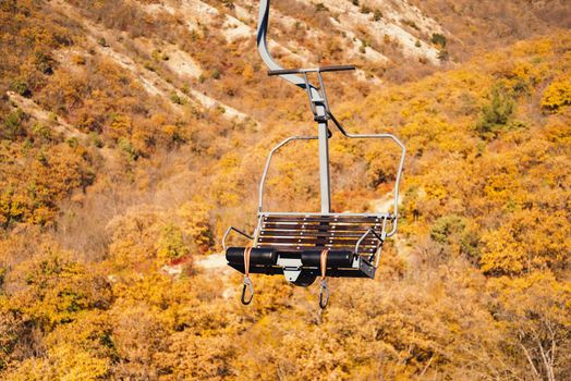 Lift chair in autumn mountains, cableway funicular chair equipment, no people