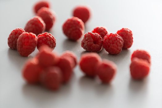 red Raspberry fruit on gray background chocolate