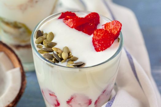 Granola with yogurt and berries for healthy breakfast on a table